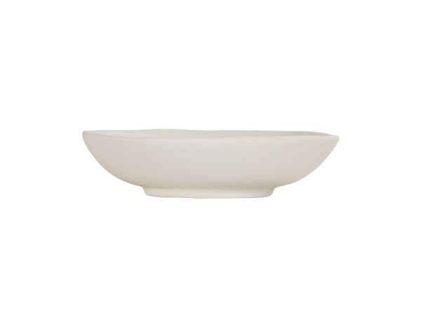 A plain, off-white Hand Thrown Bowl with a slightly irregular, organic rim and a shallow, wide shape. The bowl sits on a small, raised base against a white background. The smooth, matte surface highlights its artisanal feel.