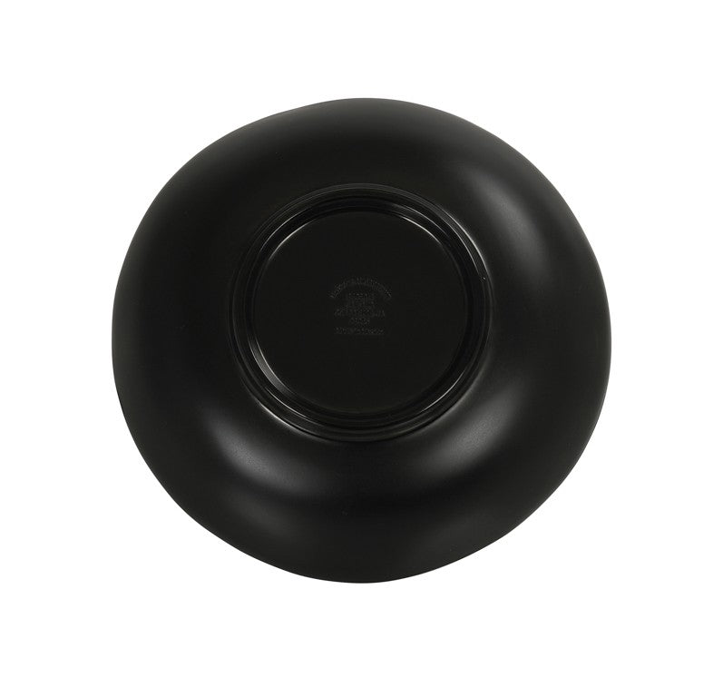 A matte black plate, reminiscent of a Hand Thrown Bowl, is shown upside down against a white background. The plate has an organic shape with a raised circular base in the center, embossed text, and a small logo. Dishwasher safe for easy cleaning.