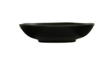 A shallow, round hand thrown bowl with slightly curved sides and a matte finish, viewed from the side against a plain white background. The bowl features smooth, clean lines and a small, raised base.