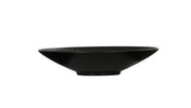 A shallow, wide-rimmed Nomi Bowl with a smooth matte finish, viewed from the side against a plain white background. This melamine bowl features a slightly flared rim, a small circular base, and is dishwasher safe for easy cleaning.