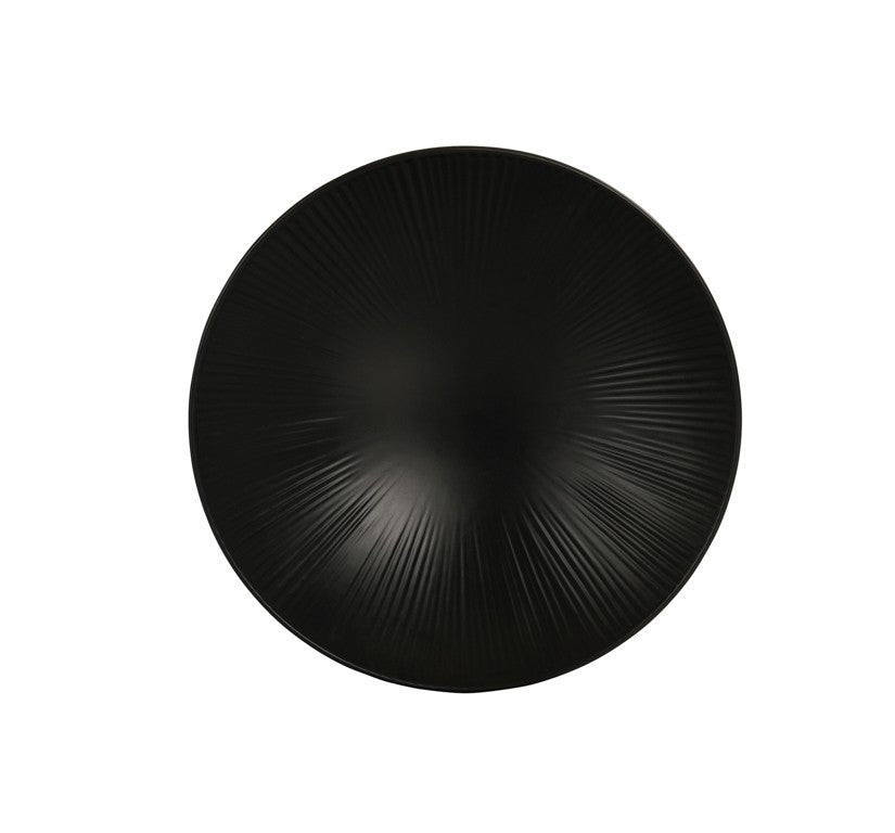 A round, matte black Nomi Bowl viewed from above, featuring a subtle, radial textured pattern that emanates outward from the center. Minimal and elegant in design, this dishwasher safe piece creates a sense of depth and movement.