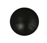 A round, matte black Nomi Bowl viewed from above, featuring a subtle, radial textured pattern that emanates outward from the center. Minimal and elegant in design, this dishwasher safe piece creates a sense of depth and movement.