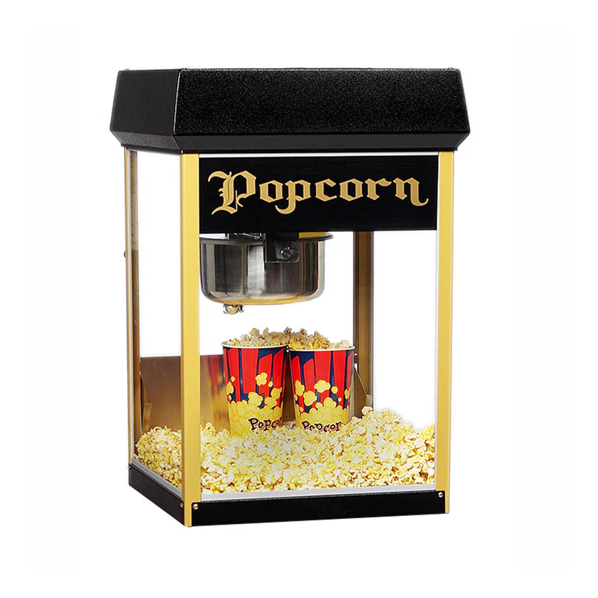 A vintage-style popcorn machine with a black and gold frame sits on a white background. Featuring an 8 oz kettle, this countertop popper displays "Popcorn" in ornate gold letters, with two red and yellow tubs surrounded by freshly popped popcorn inside.