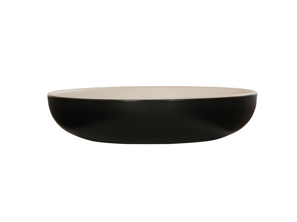 A shallow, round Sophie Pasta Bowl with a matte black melamine exterior and a smooth, light beige interior, photographed against a plain white background. The 16 oz. bowl has clean, modern lines and a low, wide profile.
