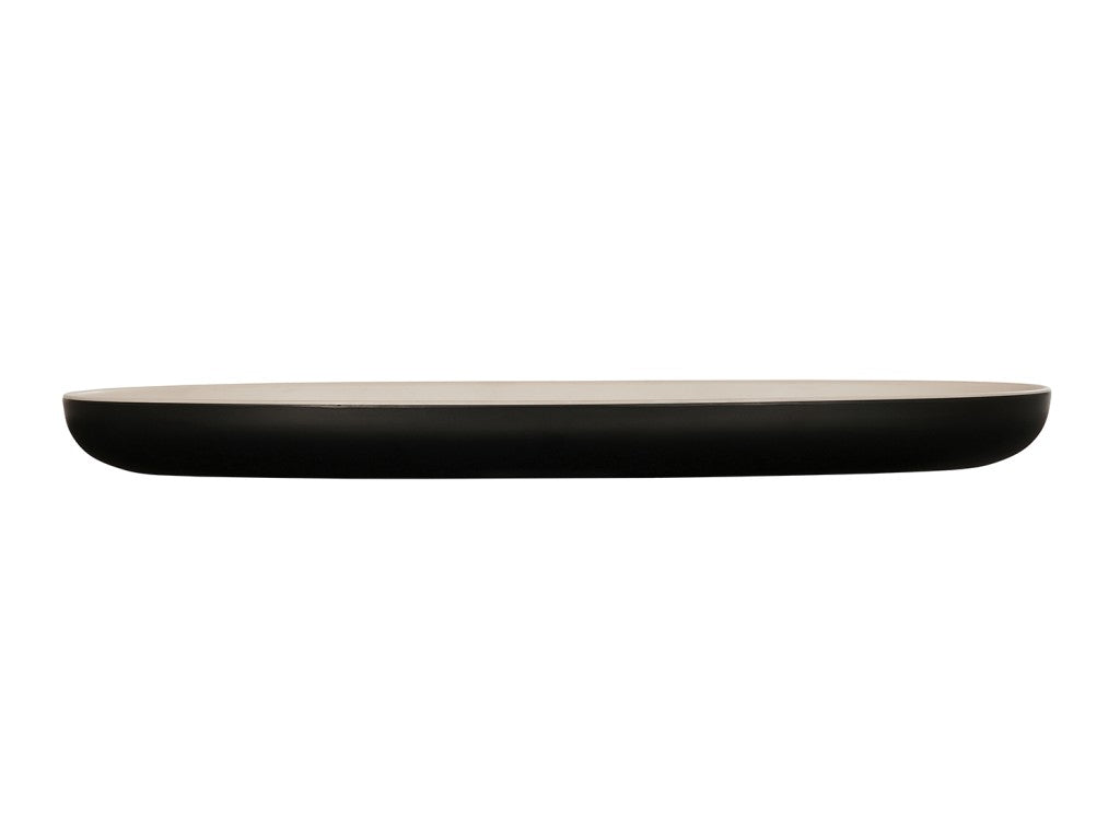 A minimalist, two-tone oval tray with a matte black exterior and beige interior, shown from the side against a white background. The tray features gently rounded edges and a smooth, modern design.
