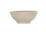 A beige ceramic Charlotte Bowl with a slightly flared rim and a narrow base, featuring fine horizontal ridges along its exterior surface. This 16 oz bowl is empty and set against a plain white background.