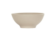 A beige ceramic Charlotte Bowl with a slightly flared rim and a narrow base, featuring fine horizontal ridges along its exterior surface. This 16 oz bowl is empty and set against a plain white background.