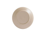 A taupe ceramic Nova Soup Bowl is shown upside down on a white background. The bottom features a circular indentation and faint embossed text in the center, indicating branding or manufacturer details. The bowl appears smooth and unadorned.
