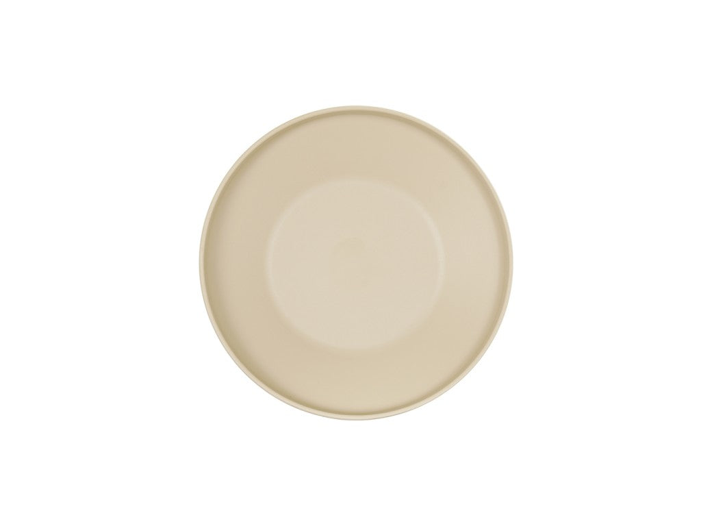 A plain, round Nova Bowl in taupe is centered on a white background. The Cal-Mil plate is empty and seen from above, showcasing its smooth, simple surface and subtle rim.