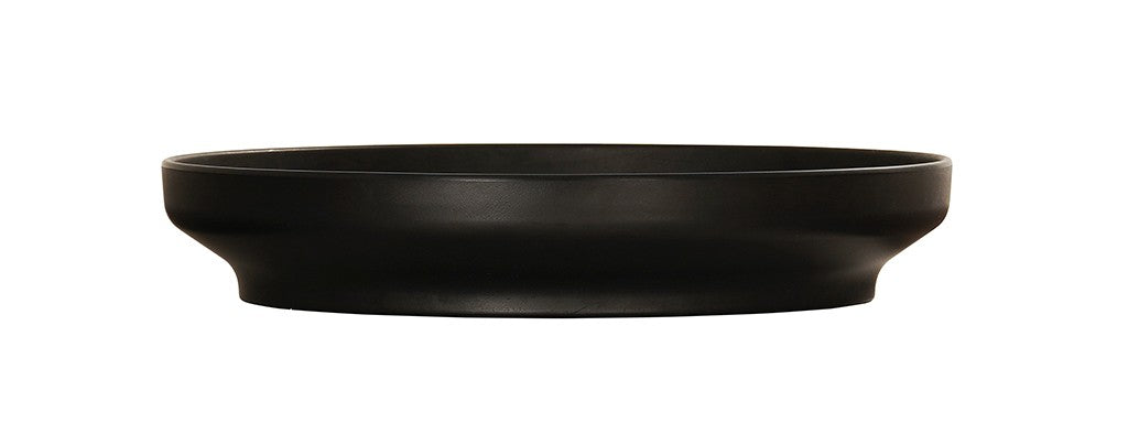 A black Nova Bowl with a modern, shallow coupe design features a wide, flat rim and gently curving sides. The bowl’s matte finish and minimalist style stand out beautifully against the white background.