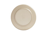 A plain, round, taupe plate is shown from above against a white background. The plate features a smooth surface and slightly raised rim around the edge. Indistinct text or branding is faintly visible in the center.