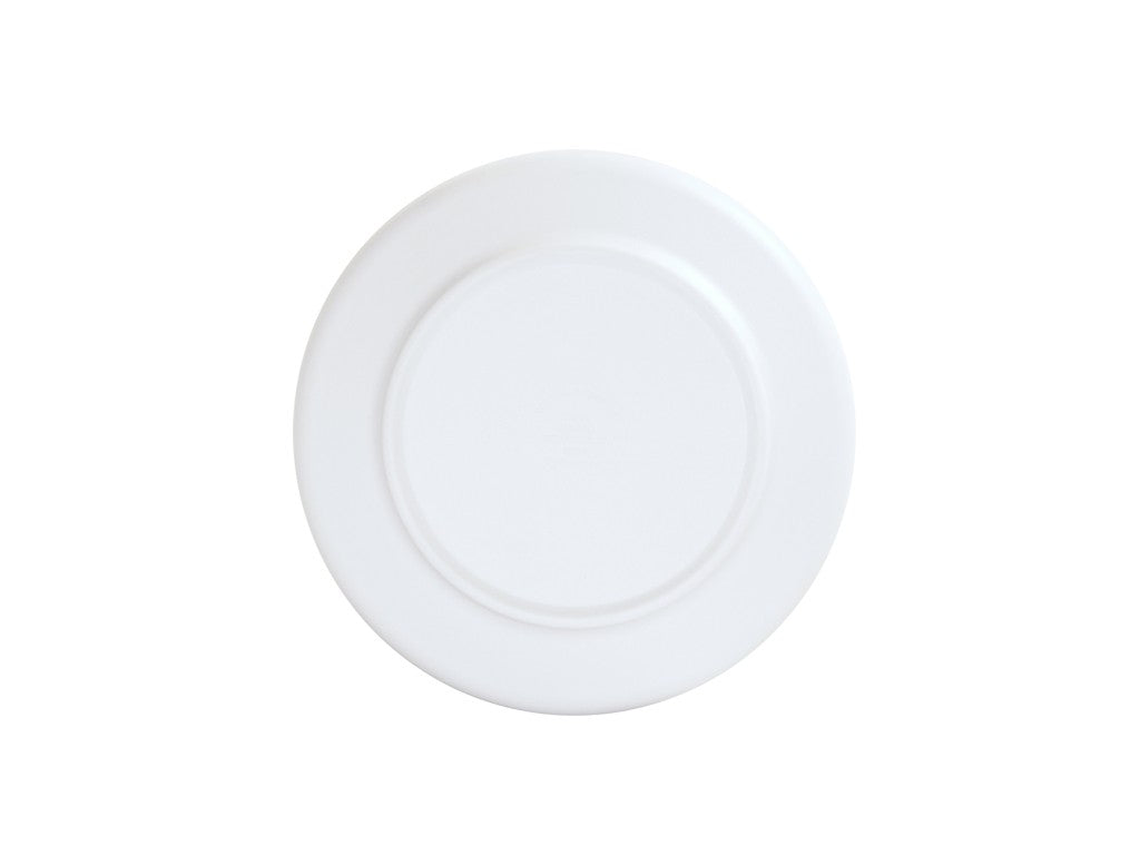 A plain, round, white coupe plate viewed from above, centered against a white background. The plate has a subtle raised rim and a smooth surface, creating a minimalistic and clean appearance.