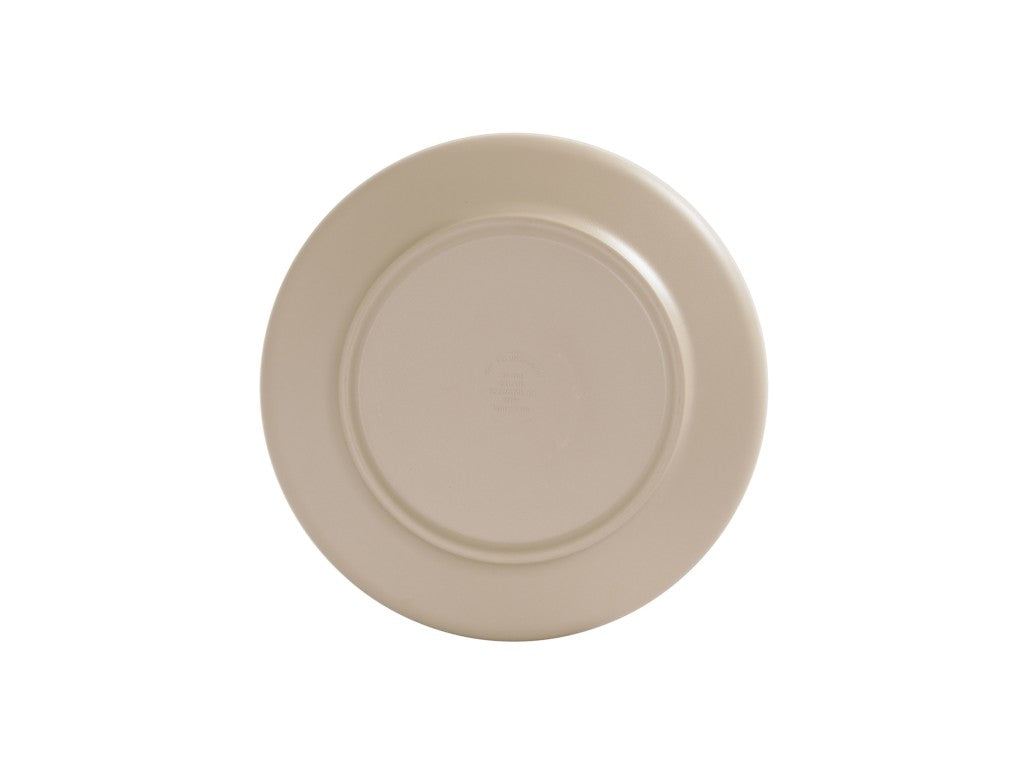 A beige ceramic Nova Bowl is shown from above against a white background. The 9 inch bowl is simple, round, and unadorned, with a raised circular base at the center, revealing the underside of the plate.