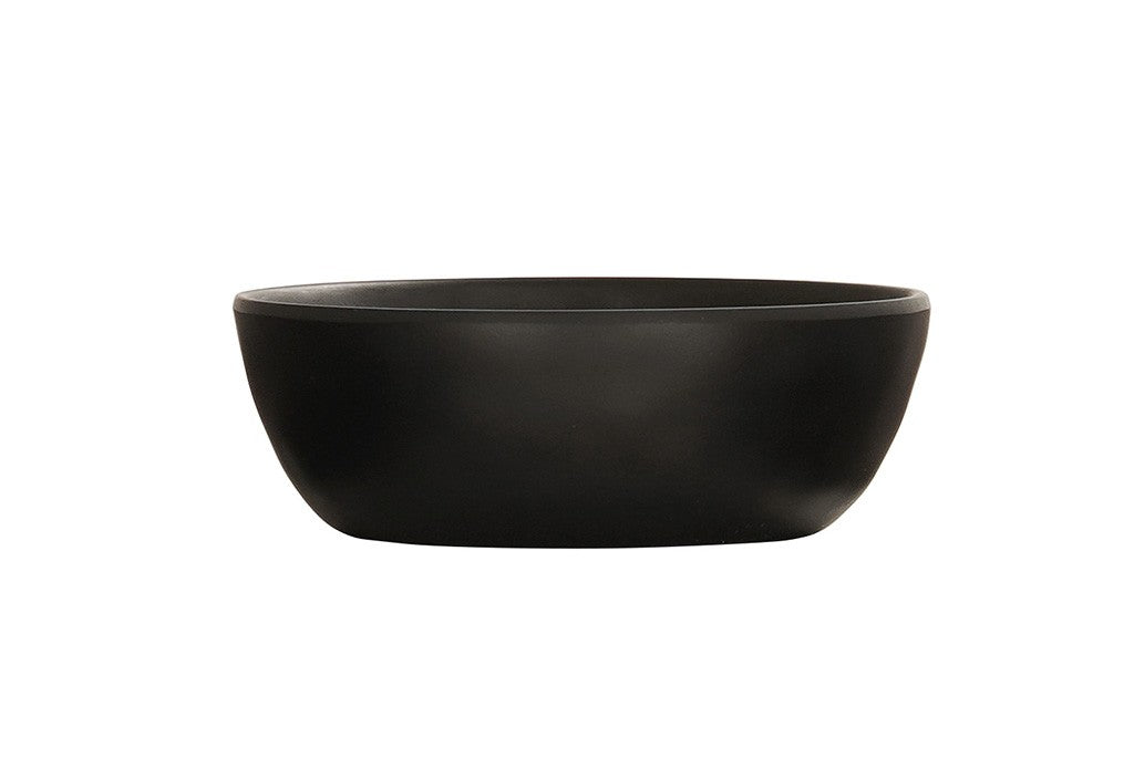 A matte black soup bowl with a smooth, round ceramic form and slightly outward-curved sides is shown empty against a plain white background, highlighting its unadorned, minimalist design.