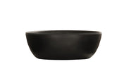 A matte black soup bowl with a smooth, round ceramic form and slightly outward-curved sides is shown empty against a plain white background, highlighting its unadorned, minimalist design.