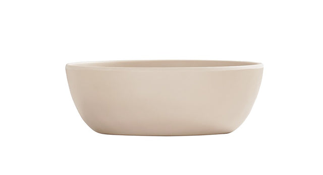 A simple, round, light beige 16 oz soup bowl with smooth sides and a matte finish, shown against a plain white background. The ceramic bowl is empty and features a minimalist, modern design.