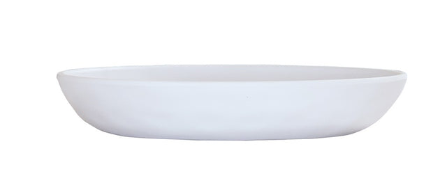 A plain, white, shallow Cal-Mil pasta bowl is shown from the side on a white background. The bowl has smooth, rounded edges and a simple, minimalist design.