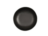 A round, empty, matte black Carmel Pasta Bowl is centered on a plain white background. This 30 oz. plate features a simple, modern design with slightly curved edges and no visible patterns or decorations.