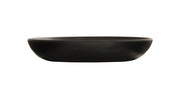 A matte black, shallow, oval-shaped pasta bowl is centered on a white background. The bowl features smooth, rounded edges and a minimalist design, with no visible patterns or decorations—perfect for modern dining.