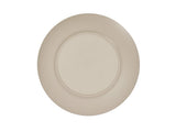 A round, beige Charlotte Bowl seen from above with a smooth, slightly raised center and a wide, textured rim featuring concentric circular grooves. The 14 inch melamine bowl has a matte, unadorned surface with no patterns or decorations.