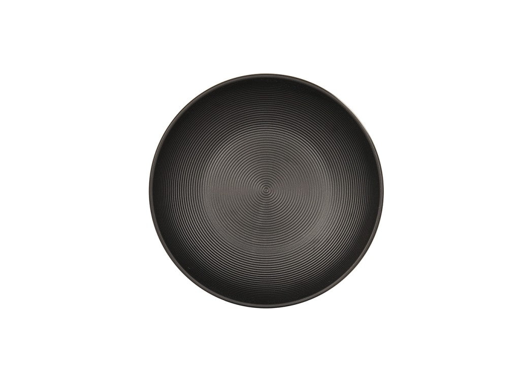 A round, black coupe bowl viewed from above, featuring subtle concentric circular ridges across its surface. The Charlotte Bowl boasts a minimalistic, modern design and is set against a plain white background.