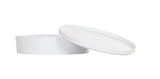 A round, white, shallow melamine container with a matching flat lid that is partially tilted and resting on the edge. The plain white background and smooth, minimalistic design make this Bento Box both stylish and dishwasher safe.