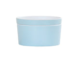 A simple, round, light blue Bento Box with a matching lid. Made from melamine, the container features a smooth surface and minimalistic design, shown against a plain white background.