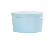 A simple, round, light blue Bento Box with a matching lid. Made from melamine, the container features a smooth surface and minimalistic design, shown against a plain white background.