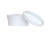 A plain, round, white container with a matching white lid resting at an angle beside it. The simple, smooth bento box is made of melamine, appears empty, and is dishwasher safe. The background is completely white.