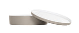 A round, shallow beige melamine container with a matching lid. The lid is slightly tilted and resting against the rim, revealing the white interior. This stylish Bento Box is dishwasher safe. The background is plain white.