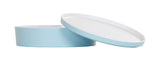 A round, shallow, light blue melamine container with a matching lid. The bento box is positioned flat, while the lid is propped at an angle. Both pieces have white interiors and are dishwasher safe, shown on a plain white background.