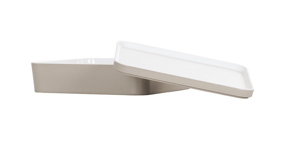 A rectangular, white ceramic dish with slightly angled sides is shown on a white background. The matching flat lid sits askew, partially revealing the interior. This dishwasher safe piece offers both convenience and style.