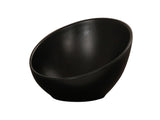 A black, modern Cal-Mil bowl with a smooth matte finish, shown at an angle that highlights its deep, slanted design. The bowl sits on a white background, emphasizing its sleek and minimalist aesthetic.