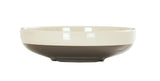 A shallow, round Vienna Bowl with a glossy finish. The upper half is cream-colored, while the lower half is a dark grayish-brown. This ceramic bowl has a smooth rim, rests on a slightly elevated base, and is set against a plain white background.