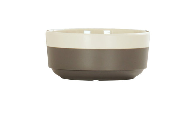 The Vienna Bowl features a simple design with a cream-colored upper half and matte gray lower half. Crafted in ceramic, this bowl has a smooth, round shape and is dishwasher safe, making it both stylish and practical.