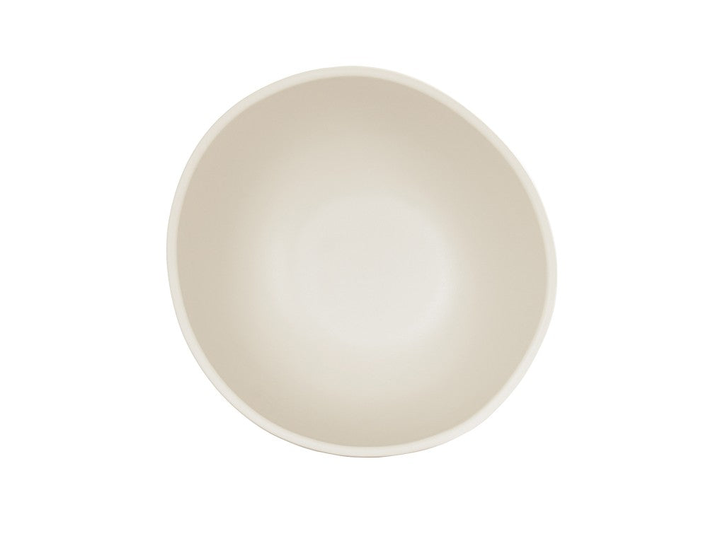 A top-down view of an empty, round Bali Soup Bowl with smooth sides. The bowl appears slightly asymmetrical, featuring gentle curves and a matte finish. Crafted from melamine, it's both stylish and dishwasher safe against a plain white background.