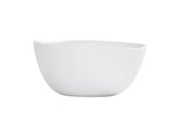 A plain, white ceramic soup bowl with smooth, slightly curved edges and a glossy finish sits against a white background. Dishwasher safe and featuring gentle contours, its simple, modern design makes it perfect for everyday use.