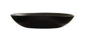 A matte black, oval-shaped ceramic Bali Pasta Bowl with a slightly irregular rim and smooth surface, photographed against a white background. This shallow bowl is dishwasher safe and minimalist, emphasizing its modern and simple aesthetic.