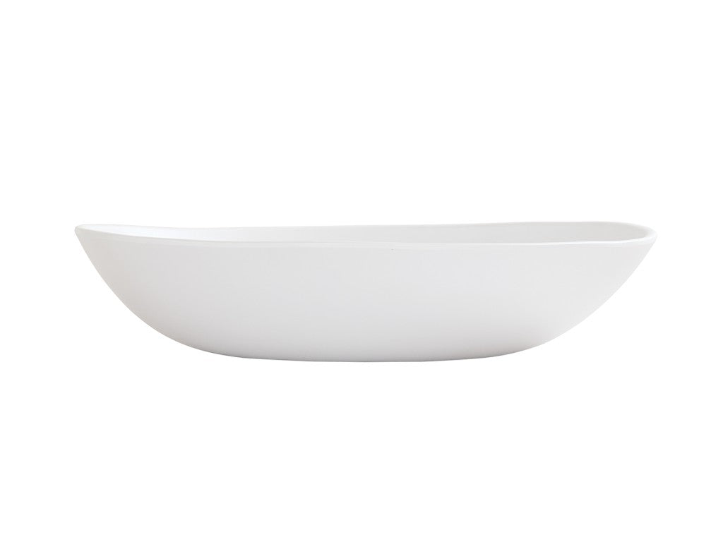 A white, oval-shaped Bali Pasta Bowl with smooth, slightly curved sides and a minimalist design, shown from the side against a plain white background; this ceramic bowl is also dishwasher safe for easy cleaning.