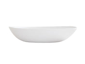 A white, oval-shaped Bali Pasta Bowl with smooth, slightly curved sides and a minimalist design, shown from the side against a plain white background; this ceramic bowl is also dishwasher safe for easy cleaning.