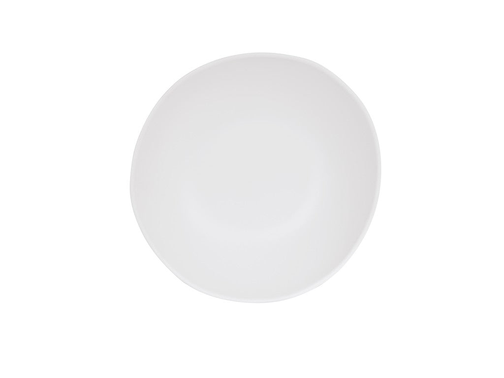 A plain, round white Bali Pasta Bowl is centered on a white background. The bowl is empty and appears smooth and clean, with slightly uneven, organic edges. Dishwasher safe, its minimalist style dominates the image.