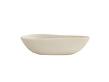 A minimalist, off-white Bali Pasta Bowl with smooth, asymmetrical curves and a matte finish, shown against a plain white background. The bowl features gently sloping sides and a slightly irregular rim for a modern, organic look.
