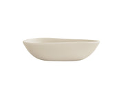 A minimalist, off-white Bali Pasta Bowl with smooth, asymmetrical curves and a matte finish, shown against a plain white background. The bowl features gently sloping sides and a slightly irregular rim for a modern, organic look.