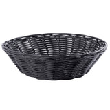 A black, round hand-woven wicker basket with an open weave pattern and slightly flared sides, shown empty against a white background. The basket’s texture and interlaced strands are clearly visible.