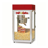 A classic Super 88 Popcorn Machine with a red top, glass sides, and a stainless kettle inside. The bottom is filled with fresh popcorn and two striped popcorn boxes. The front panel features a “Pop Corn” sign with popcorn graphics.