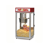 A classic countertop popcorn machine with a red top labeled Popcorn in yellow and white letters. Inside, an E-Z Kleen kettle pops fresh popcorn into striped bags, while clear glass sides display the machine’s inviting interior.