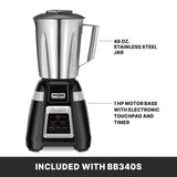 A bar blender with a stainless steel container and a 48 oz. jar sits on a black motor base featuring an electronic touchpad and timer. Labels highlight the jar and 1 HP motor base. Text at the bottom reads: “INCLUDED WITH BB340S.”.