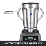 A stainless steel commercial blender with variable speed control and two side handles is labeled Waring Commercial. Text reads Blend 100+ drinks a day. Below, the display says CB15 THE LEGEND. Banner at the bottom states LIMITED THREE-YEAR WARRANTY.