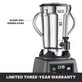 A commercial blender with a 4 liter stainless steel container, sturdy handles, and a spout sits on a black base labeled “CB15 THE LEGEND.” Text highlights “BLEND 100+ DRINKS A DAY.” Banner below reads, “LIMITED THREE-YEAR WARRANTY.”.