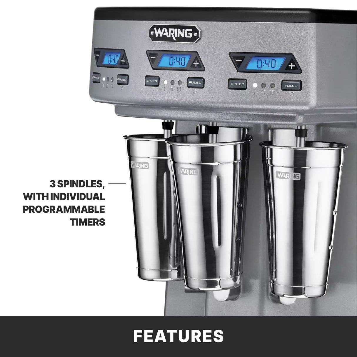 Close-up of a Waring triple spindle Drink Mixer with three stainless steel spindles and metal mixing cups, each featuring programmable digital timers and control buttons. A label highlights “3 spindles, with individual programmable timers.”.